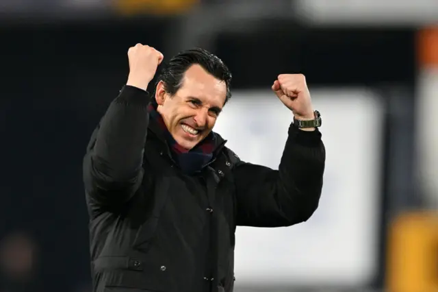 Emery salutes the away fans after Villa's victory at Luton.