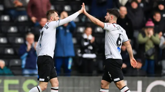 Derby players celebrate scoring against Port Vale