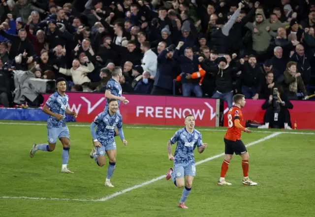 Digne is chased by teammates after scoring the winner.