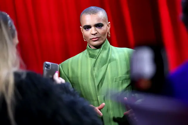 Layton Williams with people blurred in front