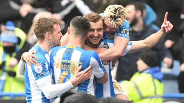 Huddersfield's Michael Helik celebrates scoring against Leeds