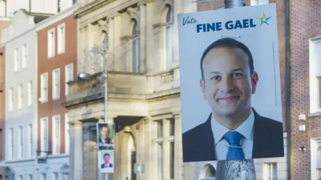 Fine Gael election poster with Leo Varadkar's face on it, tied to a lampost in Dublin