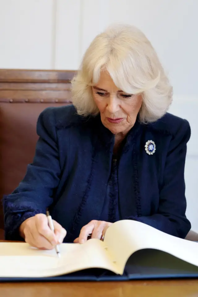 Queen Camilla signs document to confer Douglas in Iself of Man, a city