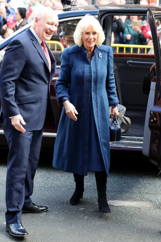 Lieutenant Governor Sir John Lorimer greets Britain's Queen Camilla on her arrival at Douglas Borough Council in Douglas, Isle of Man