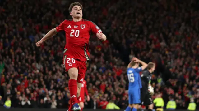 Daniel James celebrates