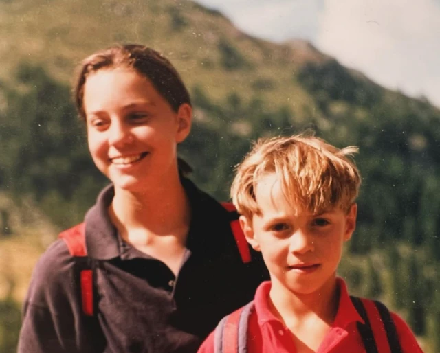 Catherine, Princess of Wales, poses next to her younger brother, James Middleton in a childhood photo