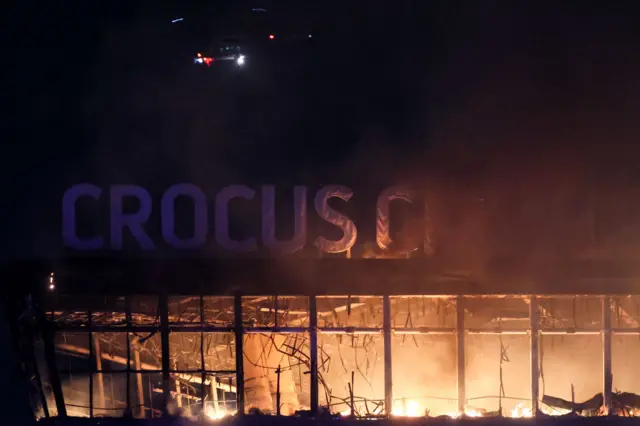 A view shows the burning Crocus City Hall concert hall following the shooting incident in Krasnogorsk, outside Moscow