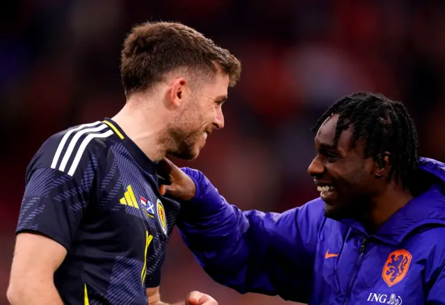 Scotland's Ryan Christie speaks to Netherlands' Jeremie Frimpong at the end of the international friendly match at the Johan Cruyff Arena, Amsterdam, Netherlands