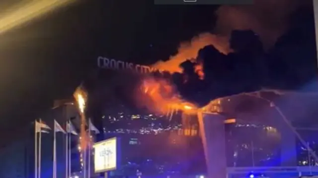 Fire engulfs the front of the Crocus City Hall