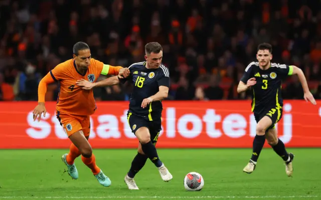 Scotland's Lawrence Shankland and  Virgil van Dijk in action during an international friendly match between the Netherlands and Scotland at the Johan Cruyff Arena