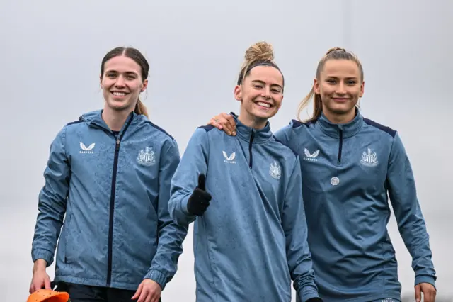 Olivia Watt (L) Jasmine McQuade (C) and Anna Soulsby (R) smile during the Newcastle United Women's Training Session
