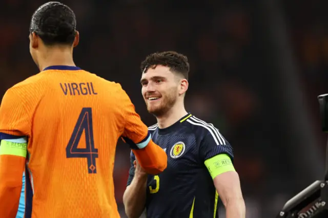 The Netherlands Virgil van Dijk and Andy Robertson shake hands during an international friendly match between the Netherlands and Scotland at the Johan Cruyff Arena