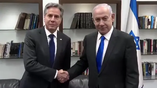 Antony Blinken shaking hands with Benjamin Netanyahu