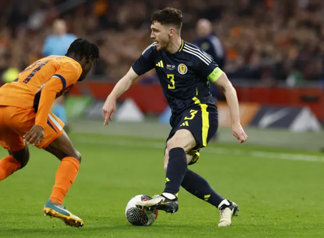 Soccer Football - International Friendly - Netherlands v Scotland - Johan Cruijff Arena, Amsterdam, Netherlands - March 22, 2024 Netherlands' Jeremie Frimpong in action with Scotland's Andy Robertson