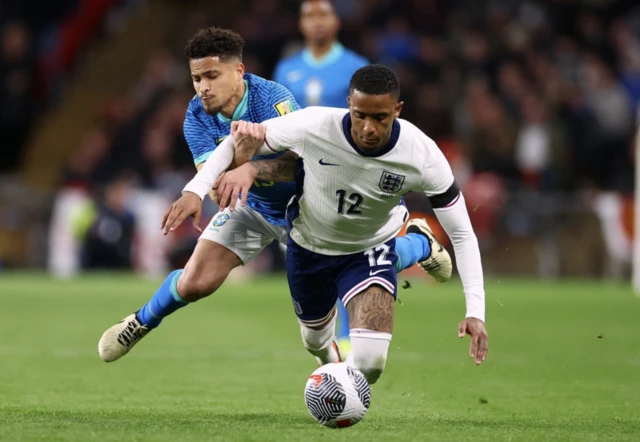 England's Ezri Konsa in action with Brazil's Joao Gomes