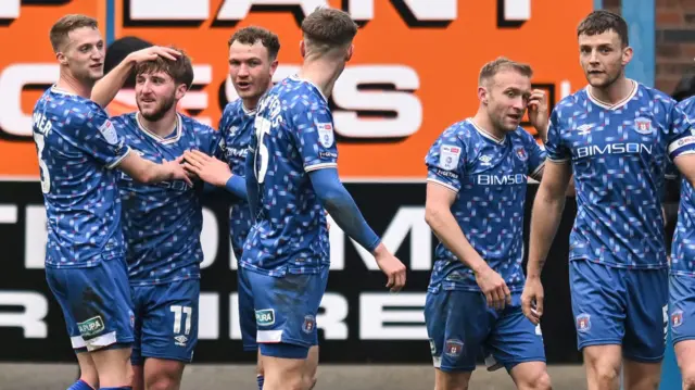 Carlisle players celebrating a goal