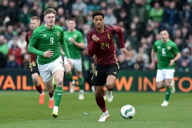 Koni De Winter of Belgium in action against Evan Ferguson of Republic of Ireland