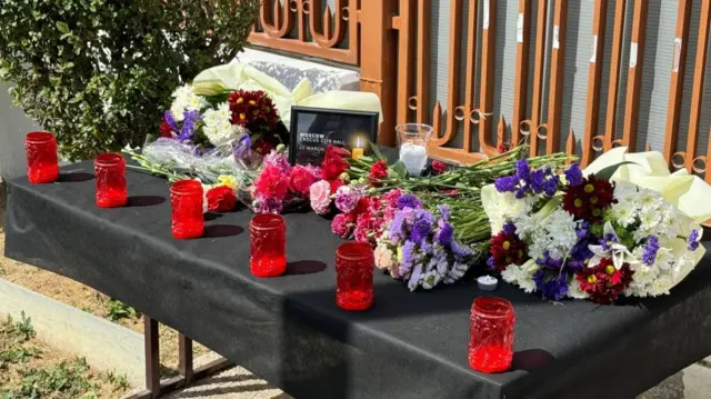 flowers and candles on a table