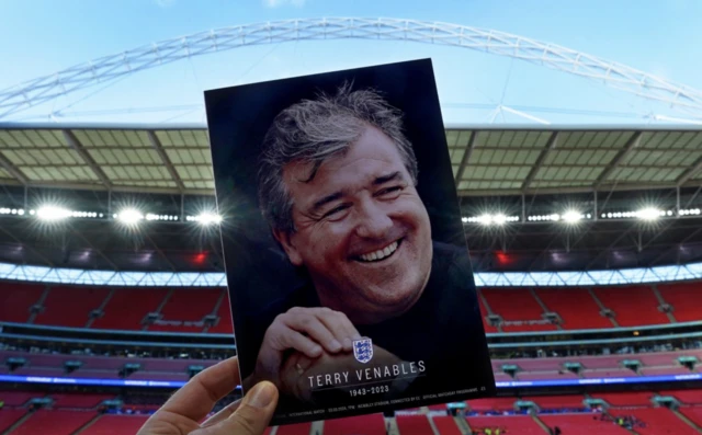 Terry Venables pictured on the match day programme for the game - backdrop of Wembley Stadium