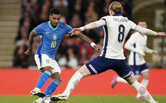 Brazil's Rodrygo and England's Conor Gallagher battle for the ball