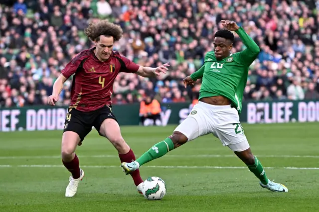 Wout Faes of Belgium and Chiedozie Ogbene of Republic of Ireland