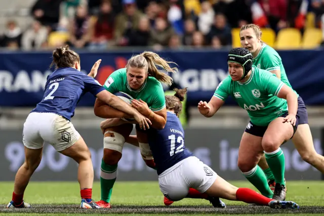 Ireland's Christy Haney with Dorothy Wall as she is tackled by France's Agathe Sochat and Gabrielle Vernier