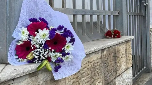 Bouquet of flowers on a wall