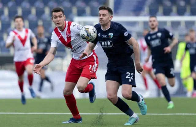 Airdrie's Nikolay Todorov and TNS' Danny Davies in action during the SPFL Trust Trophy Final match between The New Saints and Airdrieonians at Falkirk Stadium, on March 24, 2024, in Falkirk, Scotland.