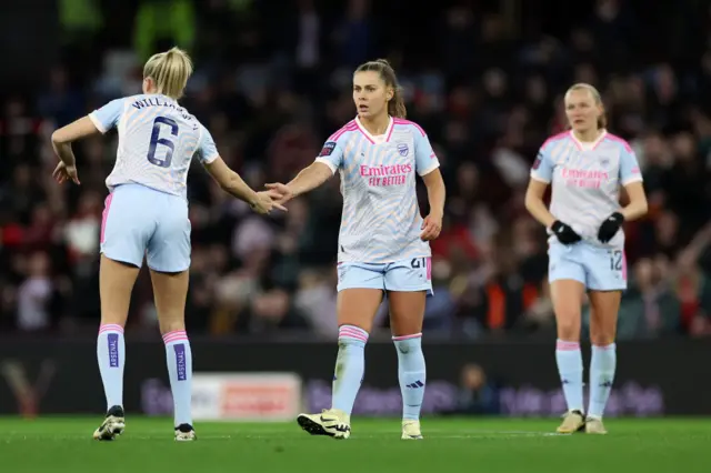 Pelova high fives WIlliamson after her goal