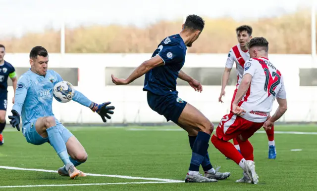 Airdrie's Liam McStravick has his shot saved by TNS' Connor Roberts during the SPFL Trust Trophy Final match between The New Saints and Airdrieonians at Falkirk Stadium, on March 24, 2024, in Falkirk, Scotland.