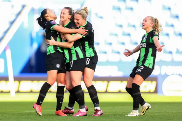 Terlandis mobbed after socring her side's third goal