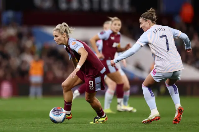 Catley pulls Daly's shirt to stop her running away