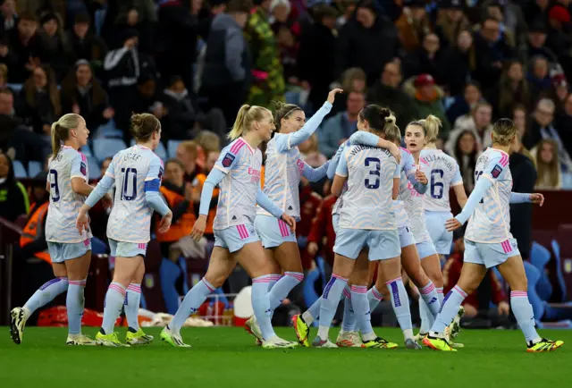 Arsenal players celebrate as they take the lead