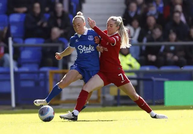 Bennison is challenged by Kearns in midfield