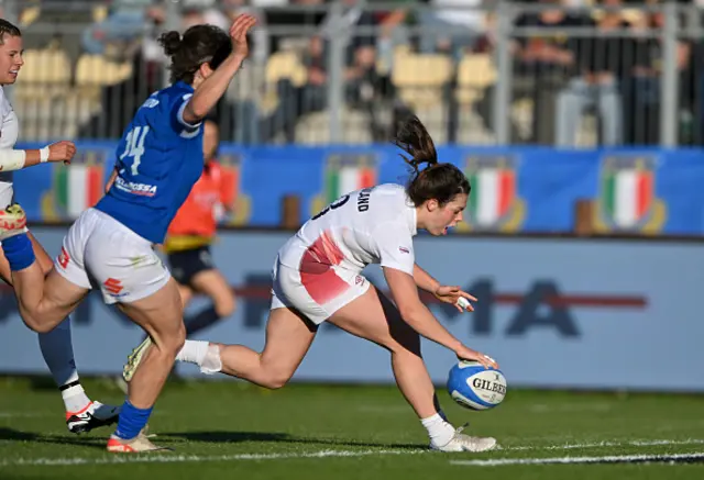 Helena Rowland of England scores her team's fifth try