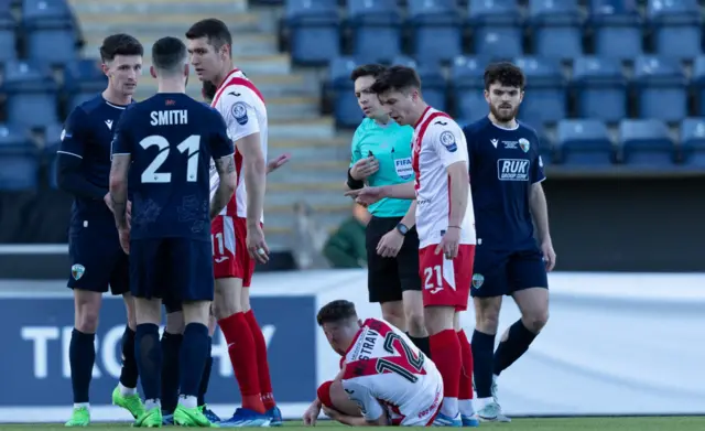 Airdrie's Liam McStravick goes down injured during the SPFL Trust Trophy Final match between The New Saints and Airdrieonians at Falkirk Stadium, on March 24, 2024, in Falkirk, Scotland.