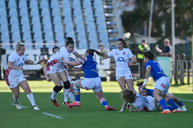 Emily Scarratt of England is challenged by Francesca Sgorbini