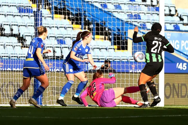 The ball bobbles into the net past Kop as Haley and her defenders watch on