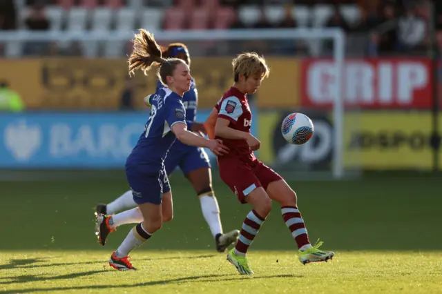 Ueki dribbles away from Charles in midfield