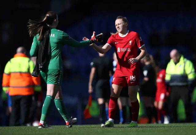 Brosnan and Holland shake hands at full time