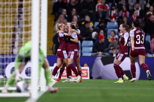 Villa players celebrate their opener