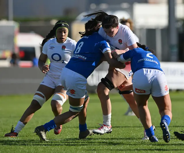 Abbie Ward of England is tackled by Giulia Cavina and Silvia Turani