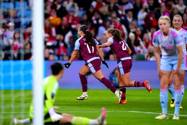 Ebony Salmon wheels away as Arsenal players stand stunned