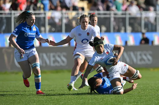 England is tackled by Jacopo Botturi of Italy