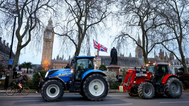 Farmers drive tractors through central London to protest against issues including food imports, as part of demonstrations from growers around the world, in London, Britain