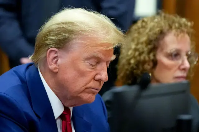 Former U.S. President Donald Trump appears with his lawyer Susan Necheles for a pre-trial hearing in a hush money case in criminal court on March 25, 2024 in New York City