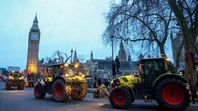 Farmers drive tractors through central London to protest against issues including food imports, as part of demonstrations from growers around the world, in London, Britain