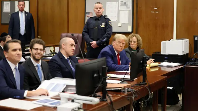 Former U.S. President Donald Trump sits with his lawyer Susan Necheles, in the courtroom at a hearing in his criminal case on charges stemming from hush money paid to a porn star in New York City, New York, USA, 25 March 2024. Trump is facing 34 felony counts of falsifying business records related to payments made to adult film star Stormy Daniels during his 2016 presidential campaign.