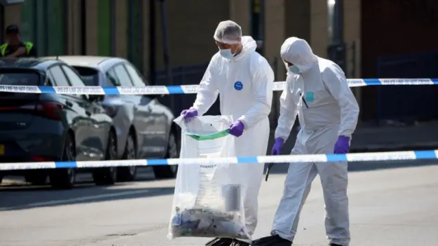 Police officers work following a deadly attack in Nottingham, Britain, June 13, 2023. REUTERS/Phil Noble