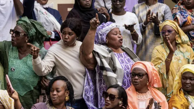 Supporters of former Prime Minister of Senegal and presidential candidate for the ruling Benno Bokk Yakaar (BBY) coalition Amadou Ba chant ahead of a press conference in Dakar on March 25, 2024.